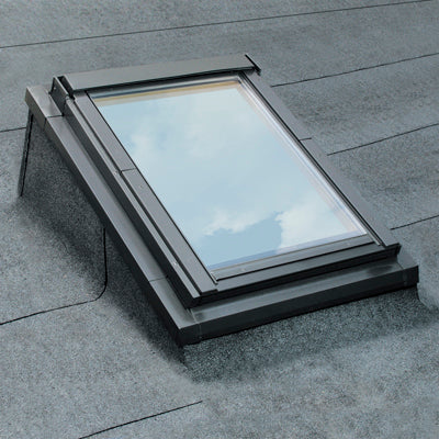 Skylight window on a roof with a gray roof