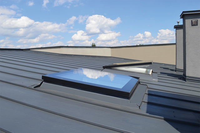 Secure Manually Operated Flat Roof Window on roof